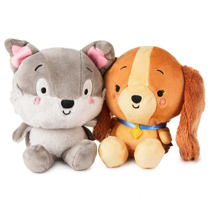 Two Better Together plush toy dogs, one gray and one brown, sitting together on a white background.