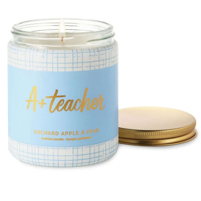 Candle in a jar labeled 'A+ Teacher' with a blue label and gold text on a white background.