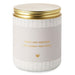 Candle jar with gold lid and text 'Sweet New Memories for a Sweet New Family' on a white background