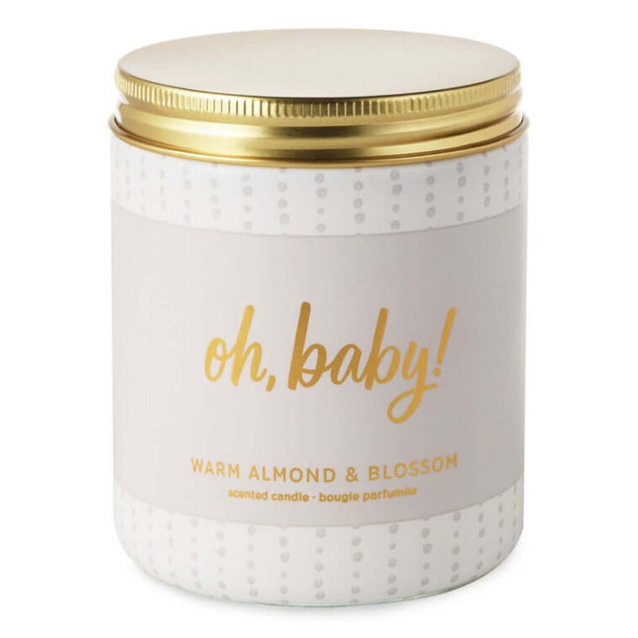 Candle jar with 'oh, baby!' text and gold lid on a white background