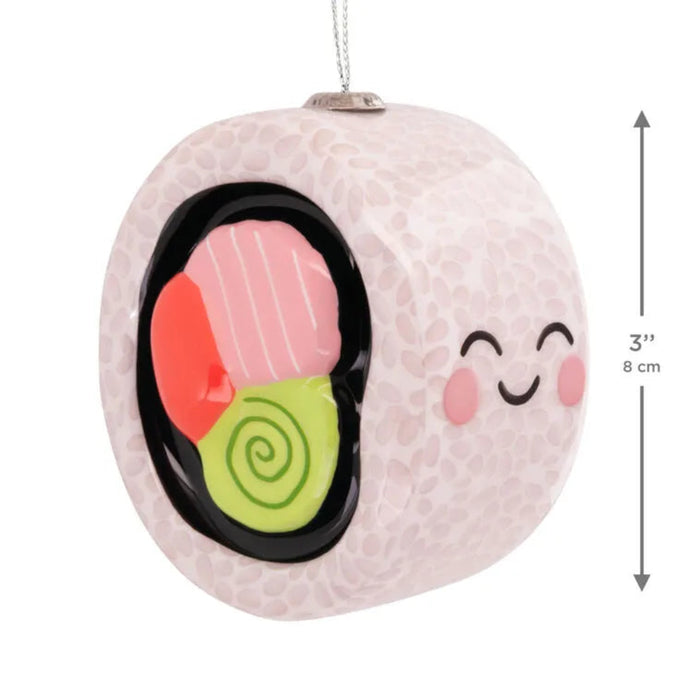 Decorative ornament shaped like a piece of sushi with a happy face with product measurements  on a white background