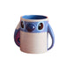 Blue and white mug shaped like a cartoon character Stitch on a white background