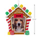 Decorative gingerbread house-shaped ornament with a dog photo and 'my furst Christmas 2025' text.