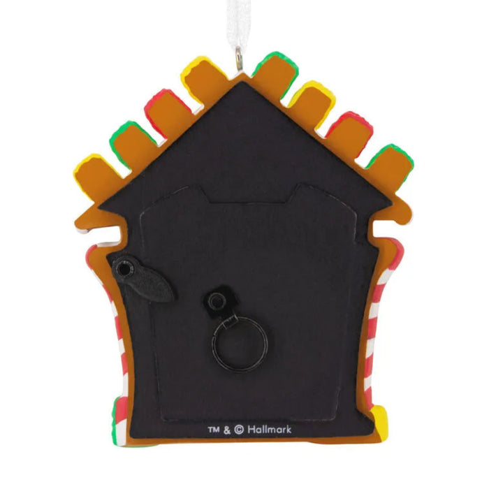 Decorative Doghouse ornament with colorful roof on a white background