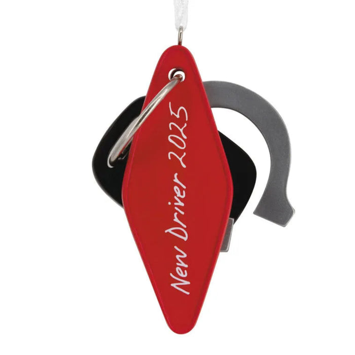 Red keychain with 'New Driver 2025' text on a white background