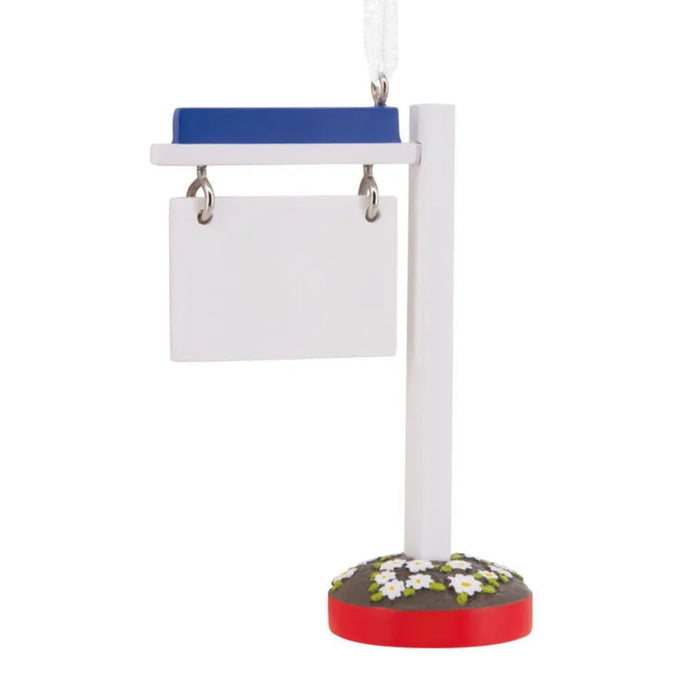 Bird toy with a red base, white perch, and blue platform on a white background
