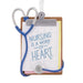 Decorative ornament with stethoscope and clipboard displaying 'Nursing is a work of heart' text on a white background.