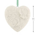 Heart-shaped ceramic ornament with floral patterns and a green ribbon on a white background