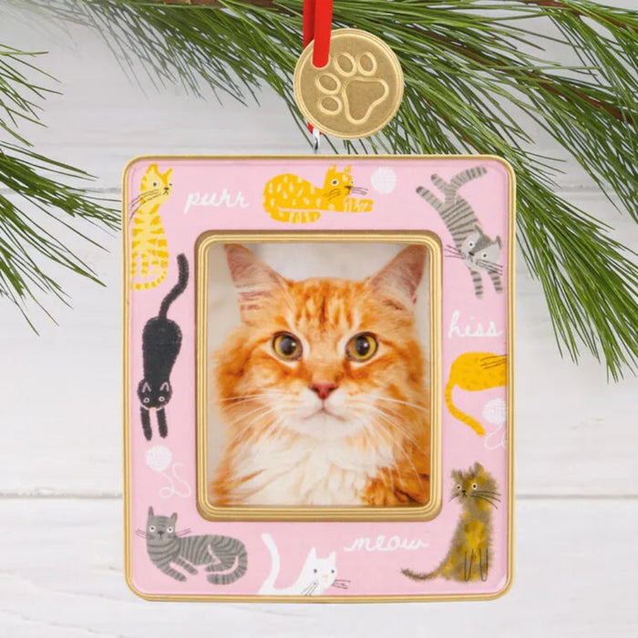 Cat-themed photo frame ornament with a pink border and cat illustrations on a white background.