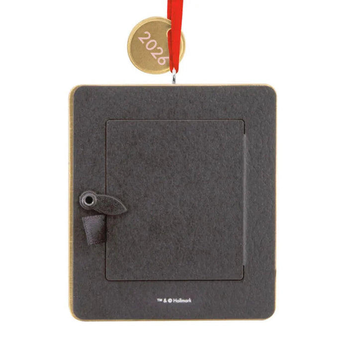 Gray felt book ornament with a red ribbon on a white background