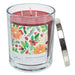 Candle with a decorative label featuring cranberry and orange fruits and a silver lid on a white background