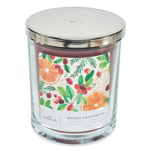 Hallmark Candle jar with a decorative label featuring cranberry and orange fruits and leaves on a white background