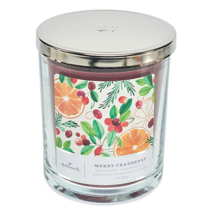 Hallmark Candle jar with a decorative label featuring cranberry and orange fruits and leaves on a white background