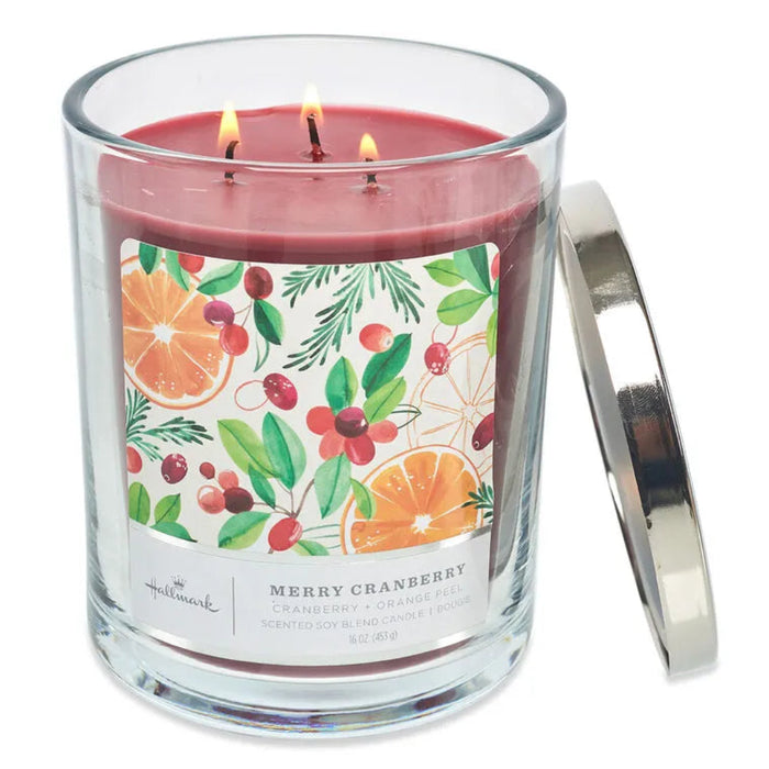 Three-wick candle cranberry scented  in a glass jar with a colorful label on a white background