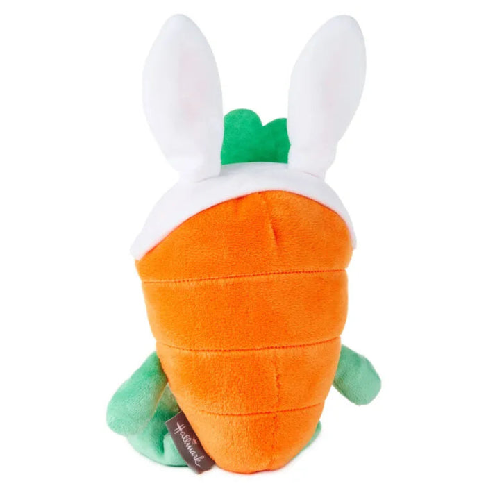 Plush toy shaped like a carrot with bunny ears on a white background
