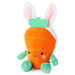 Plush toy carrot with bunny ears on a white background