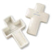 Two ceramic cross-shaped containers with engraved text on a white background