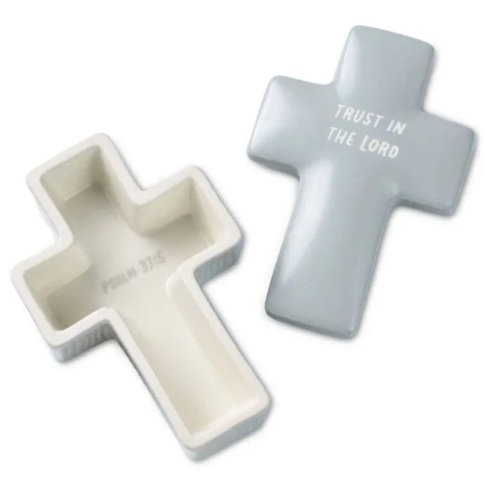 Two cross-shaped containers, one white and one gray, with 'Trust in the Lord' text on a white background.