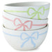 Set of three white bowls with colorful bow designs on a white background