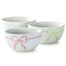 Set of four ceramic bowls with pastel color stripes on a white background