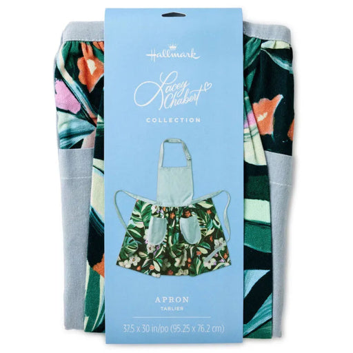 Packaged apron with floral design on a blue background, featuring Hallmark's Luau Collection branding.