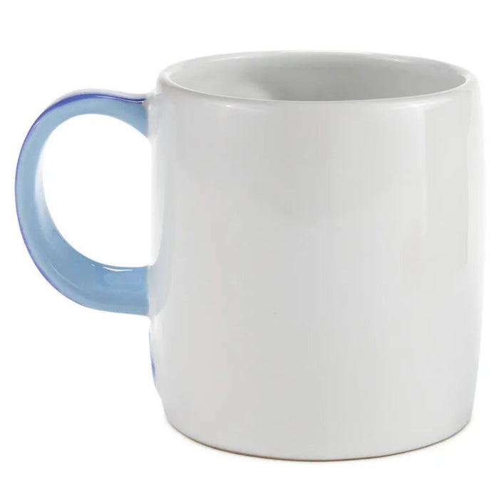White mug with a blue handle on a white background