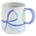White mug with blue handle and abstract design on a white background
