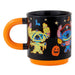 Black mug with Halloween-themed designs featuring cartoon characters Stitch on a white background