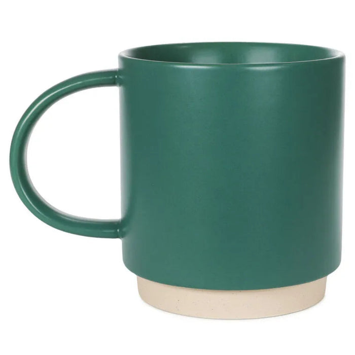 Green mug with a beige base on a white background