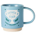 Blue mug with a trophy graphic and text on a white background