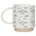 White mug with colorful fish pattern on a white background