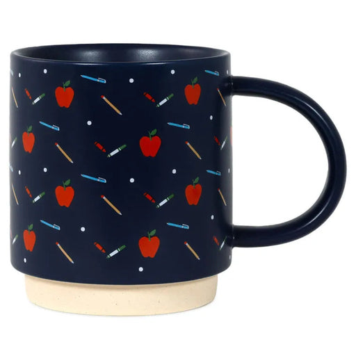 Navy mug with red apple and colorful stick figure pattern on a white background