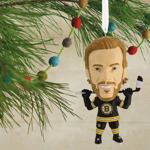 Hockey player ornament hanging on a Christmas tree