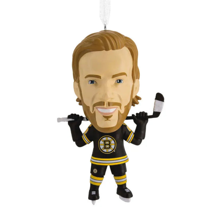 Hockey player ornament in Boston Bruins uniform on a white background