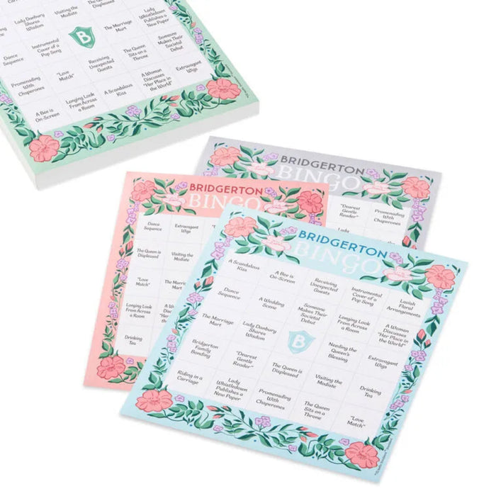Bridgerton bingo game pad with multiple tear-off bingo sheets fanned out beside the pad, featuring pastel floral borders and a Regency-inspired bingo grid on a white background.”