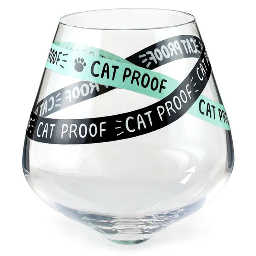 Clear glass with 'Cat Proof' tape wrapped around it on a white background
