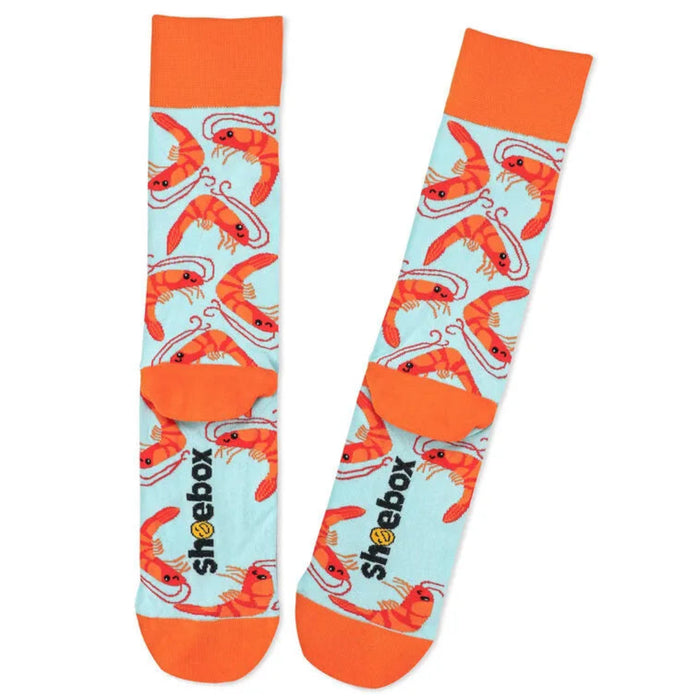 Socks with shrimp pattern and 'shoebox' branding on a light blue background
