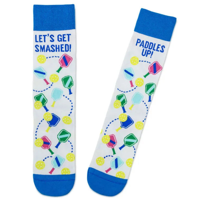 Two socks with paddle ball designs and text on a white background