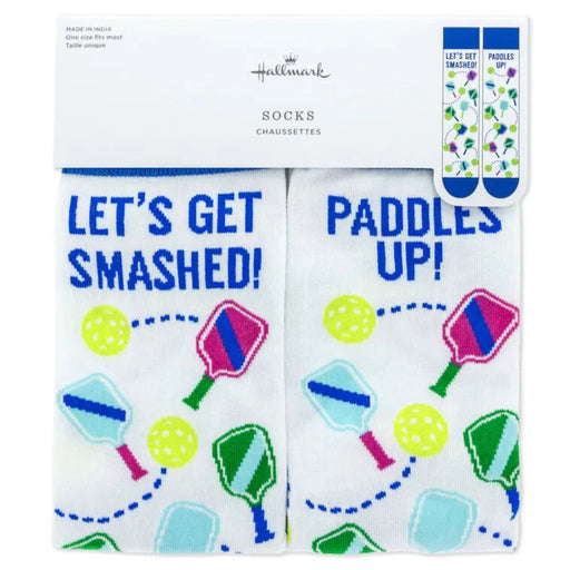 Two pairs of socks with humorous text and paddle ball graphics on a white background, branded as Hallmark.