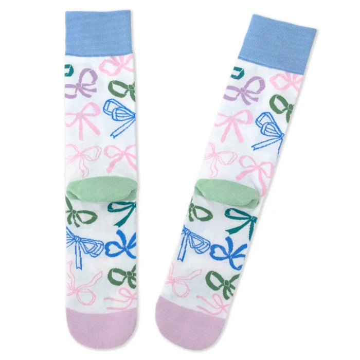 Pair of socks with colorful bow pattern on a white background