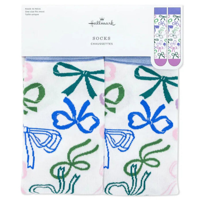 Pair of socks with bow design in packaging, featuring Hallmark branding.