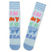 Light blue socks with colorful text 'IN MY COZY ERA' on a white background