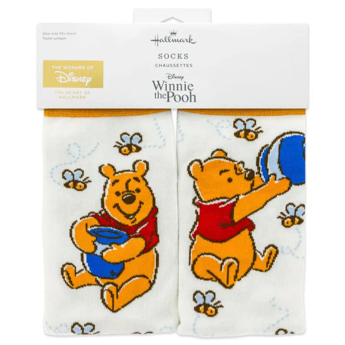 Packaged socks with Winnie the Pooh design on a white background
