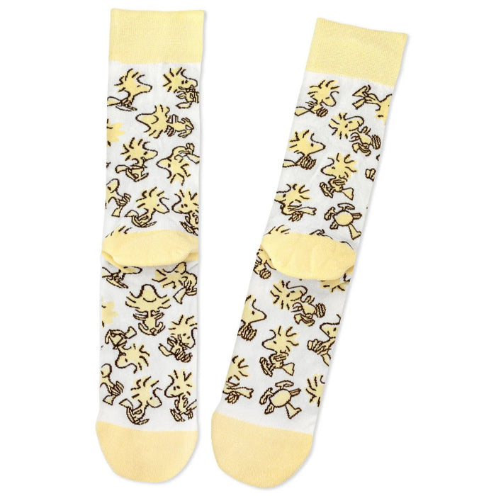 Pair of  Woodstock socks with yellow and white design on a white background