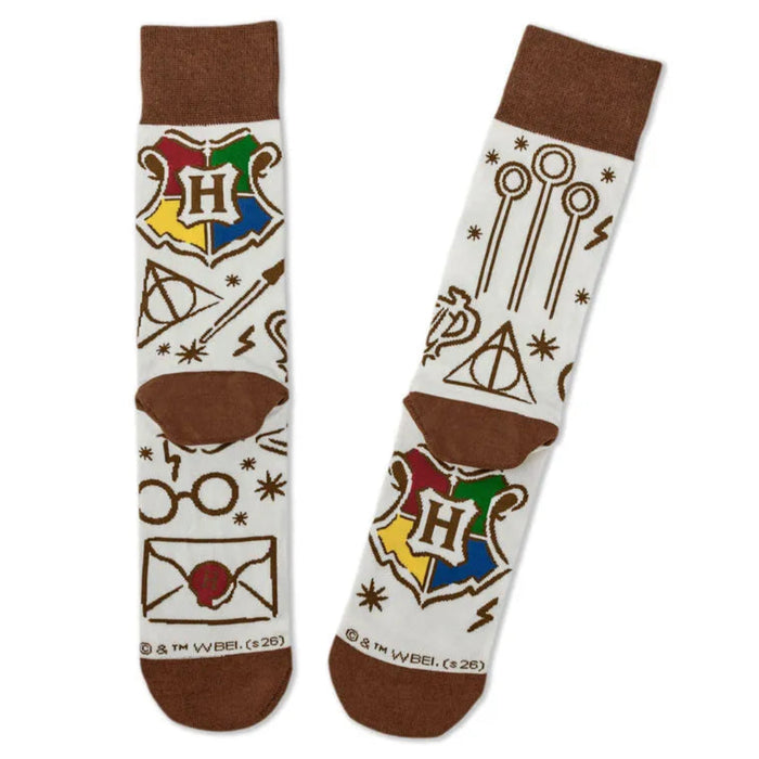 Harry Potter-themed socks with iconic symbols on a white background