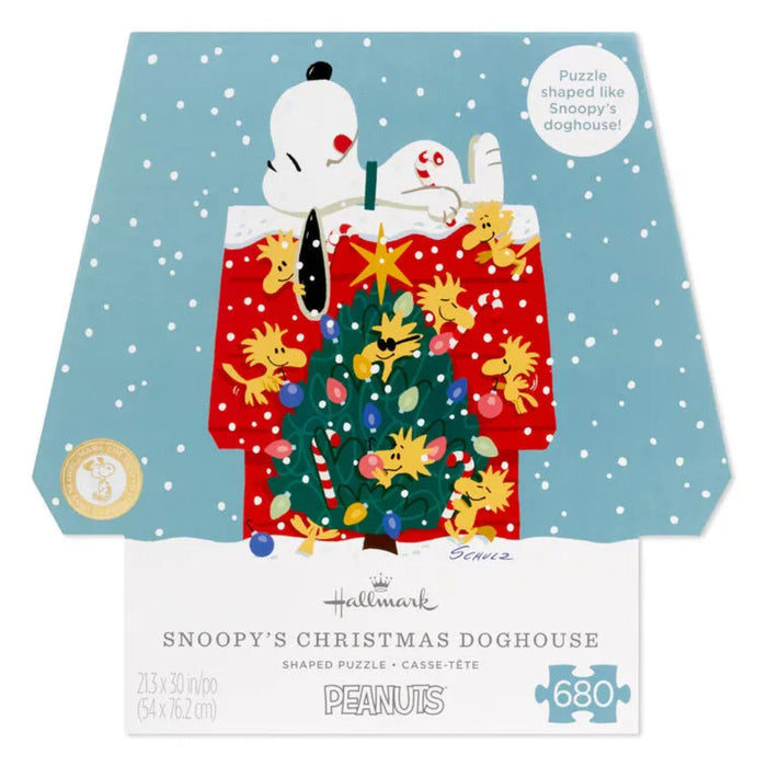 Snoopy-themed Christmas puzzle packaging with a doghouse and tree design.