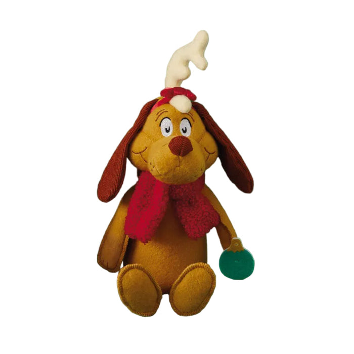 Plush toy dog Max  with red scarf and ornament in his paw on white background