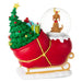 Decorative Christmas ornament with a sleigh, Christmas tree, presents, and a snow globe with a dog on a white background.
