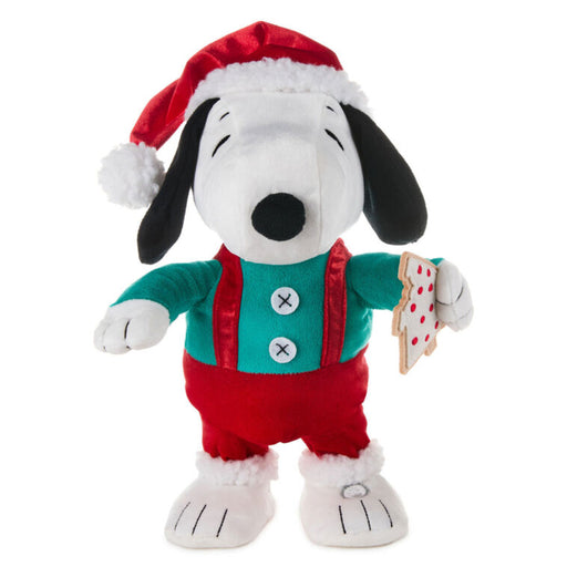 Plush toy of a dog wearing a Santa hat and outfit on a white background