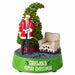 Christmas-themed figurine with a man in a red coat, tree, and chair on a white background.